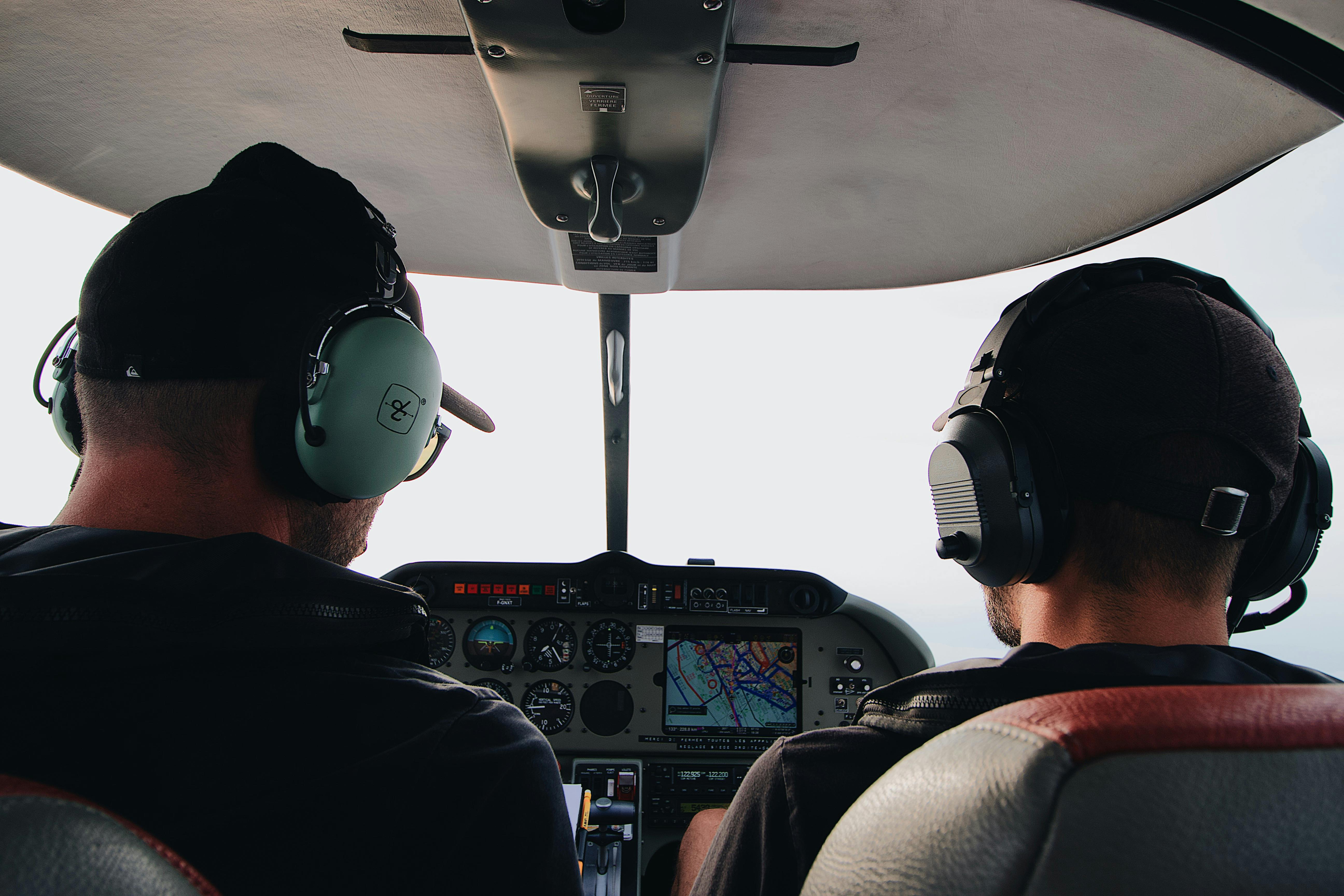 two-men-sitting-inside-helicopter-free-stock-photo