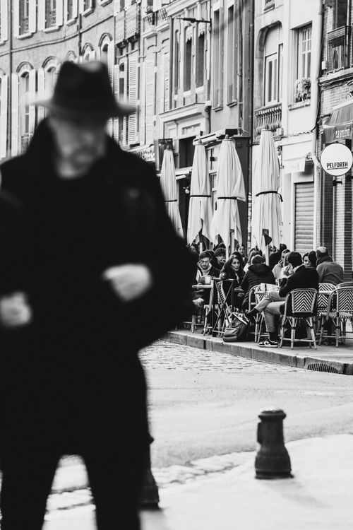 Free Black and white street scene with people dining outdoors in Toulouse, France. Stock Photo