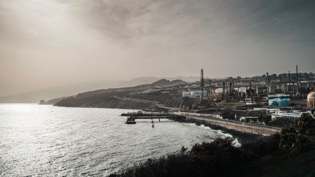 A scenic view of an industrial area along the coast of Santa Cruz de Tenerife, Spain.
