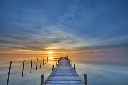 Free Serene view of dawn at a lake in Bavaria, reflecting vibrant skies and calming waters. Stock Photo