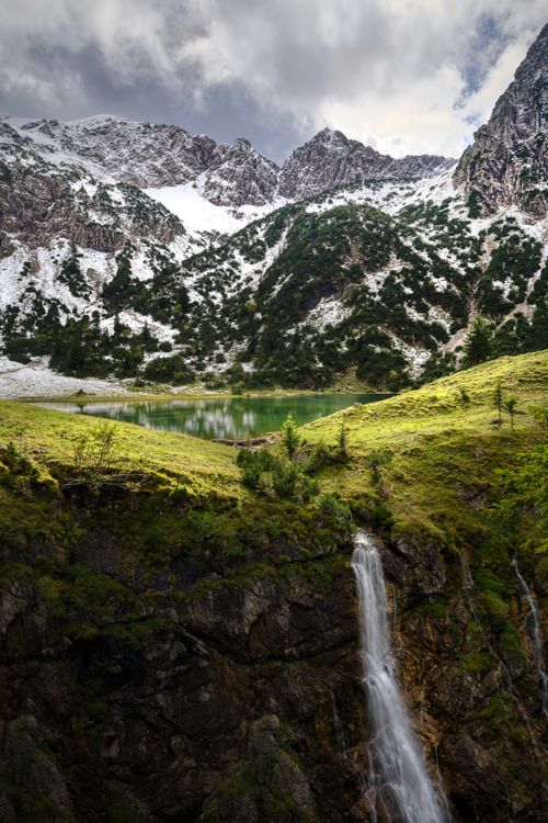 Free Breathtaking view of a waterfall and alpine lake in Oberstdorf, Germany. Stock Photo