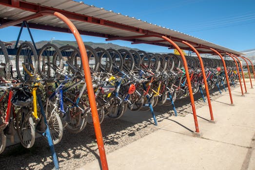 Multiple bicycles parked under a shelter on a sunny day in Gachancipá, Colombia.