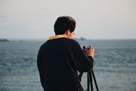 Photo of Man Using His Camera