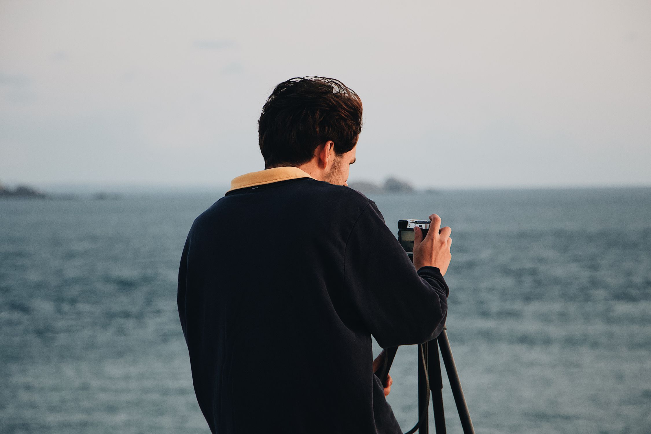 Pule Using His Camera Photo of Man Using His Camera · Free Stock Photo