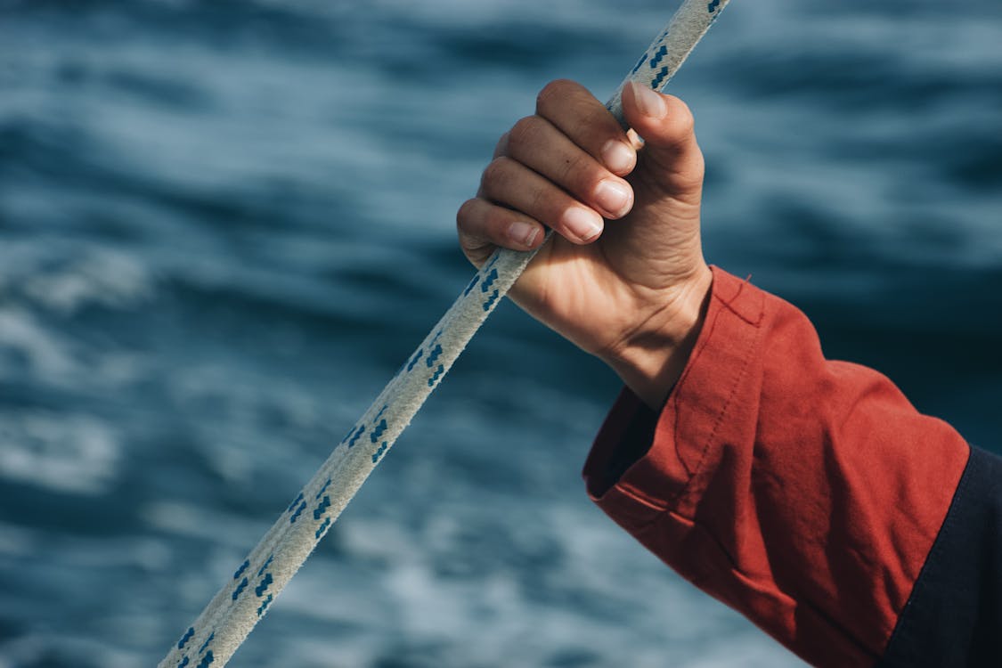 Person Holding on Rope · Free Stock Photo