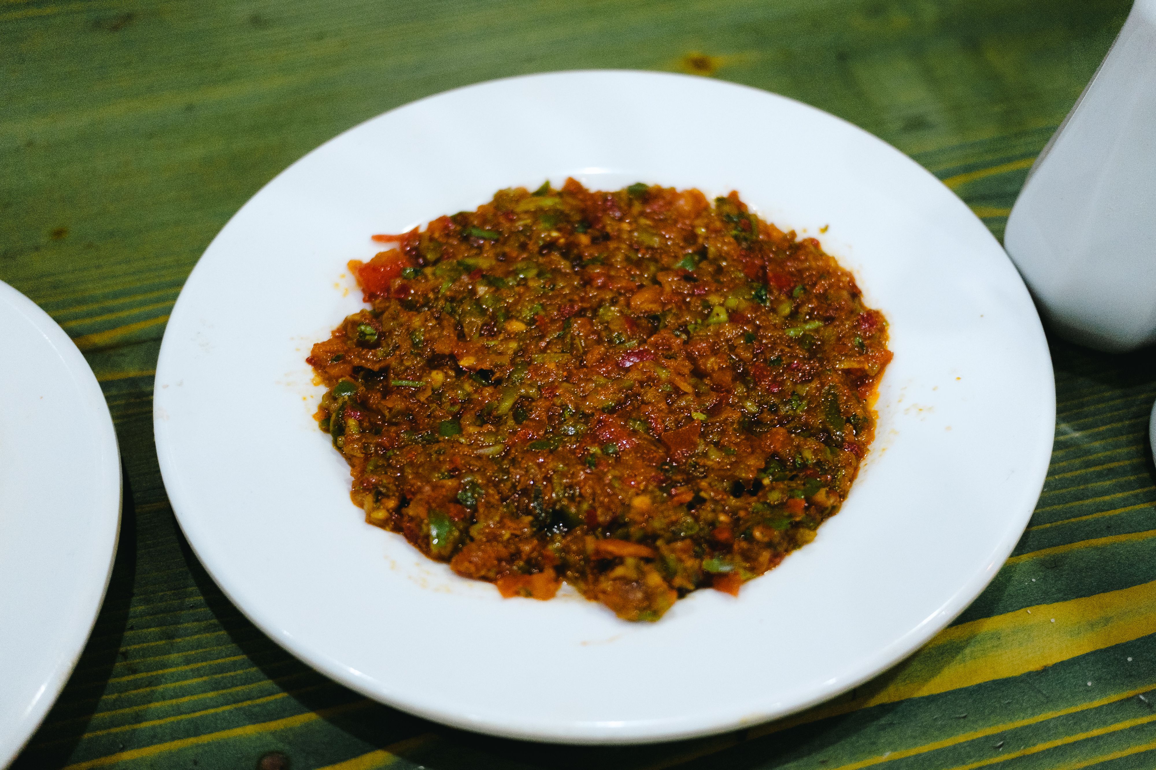 Delicious Turkish Ezme salad served on a white plate, ideal for traditional and vegan dishes.