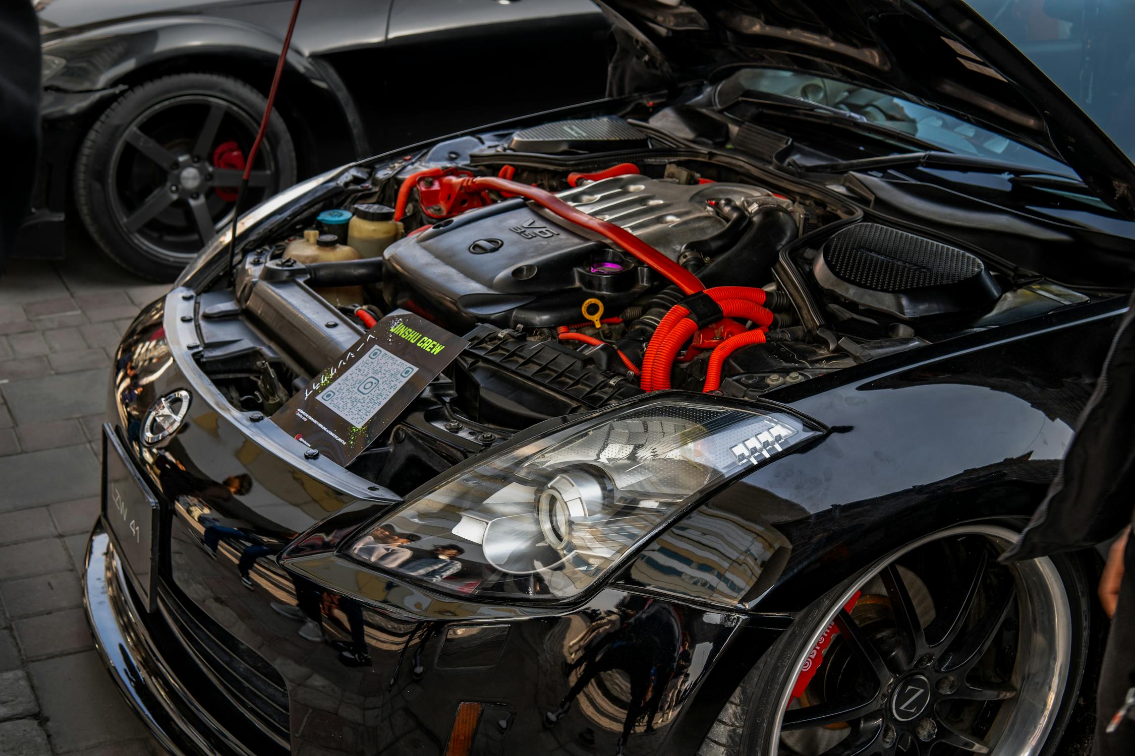High-performance car engine showcased outdoors · Free Stock Photo