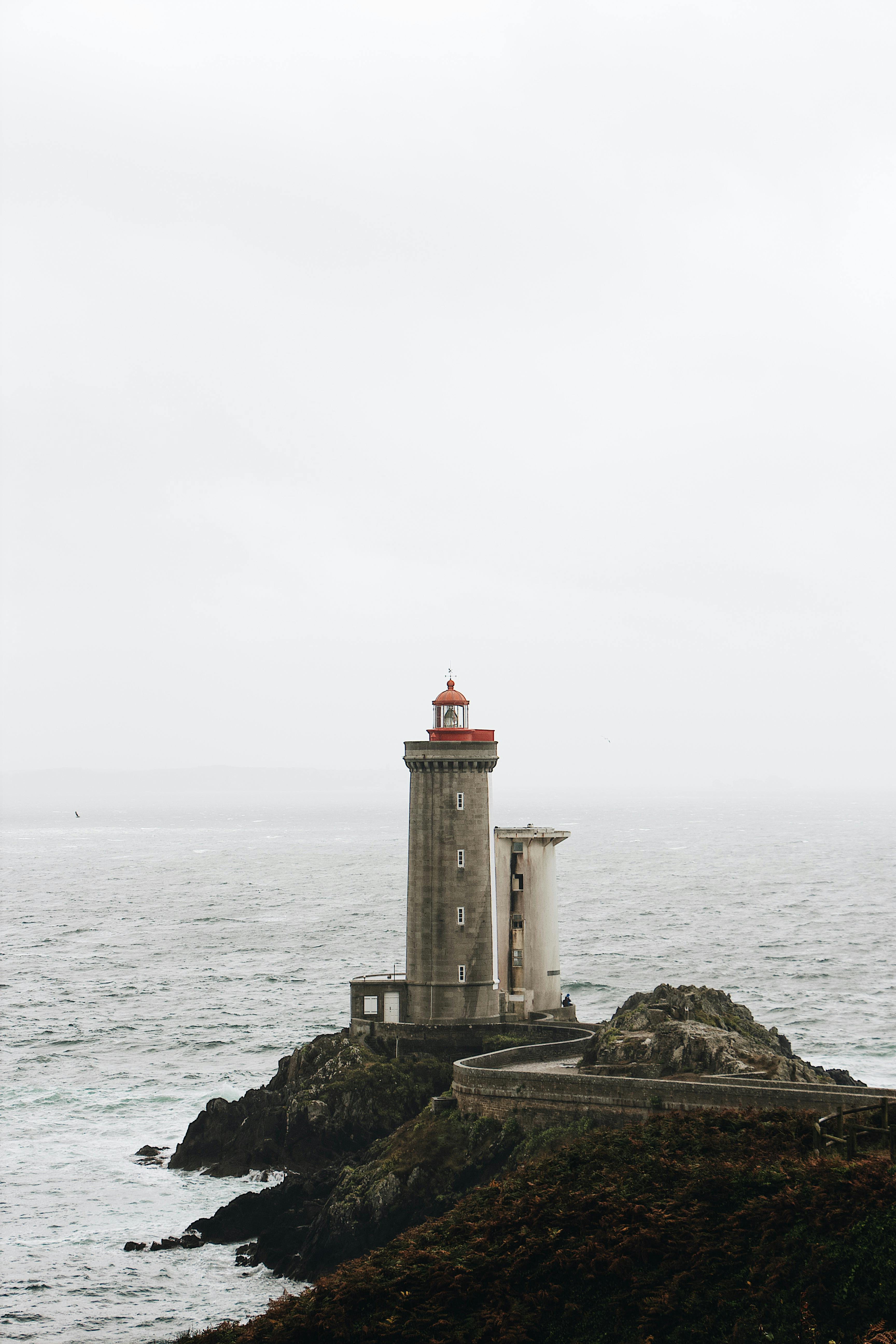 photo of lighthouse on seaside during daytime