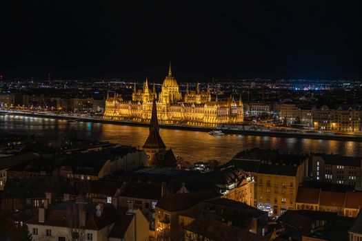Stunning nighttime view of the illuminated Hungarian Parliament Building in Budapest.