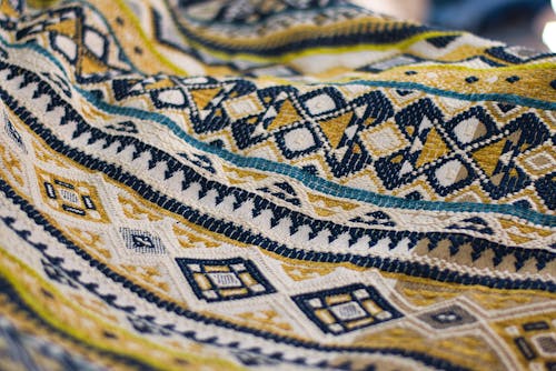 Yellow, White, And Black Textile