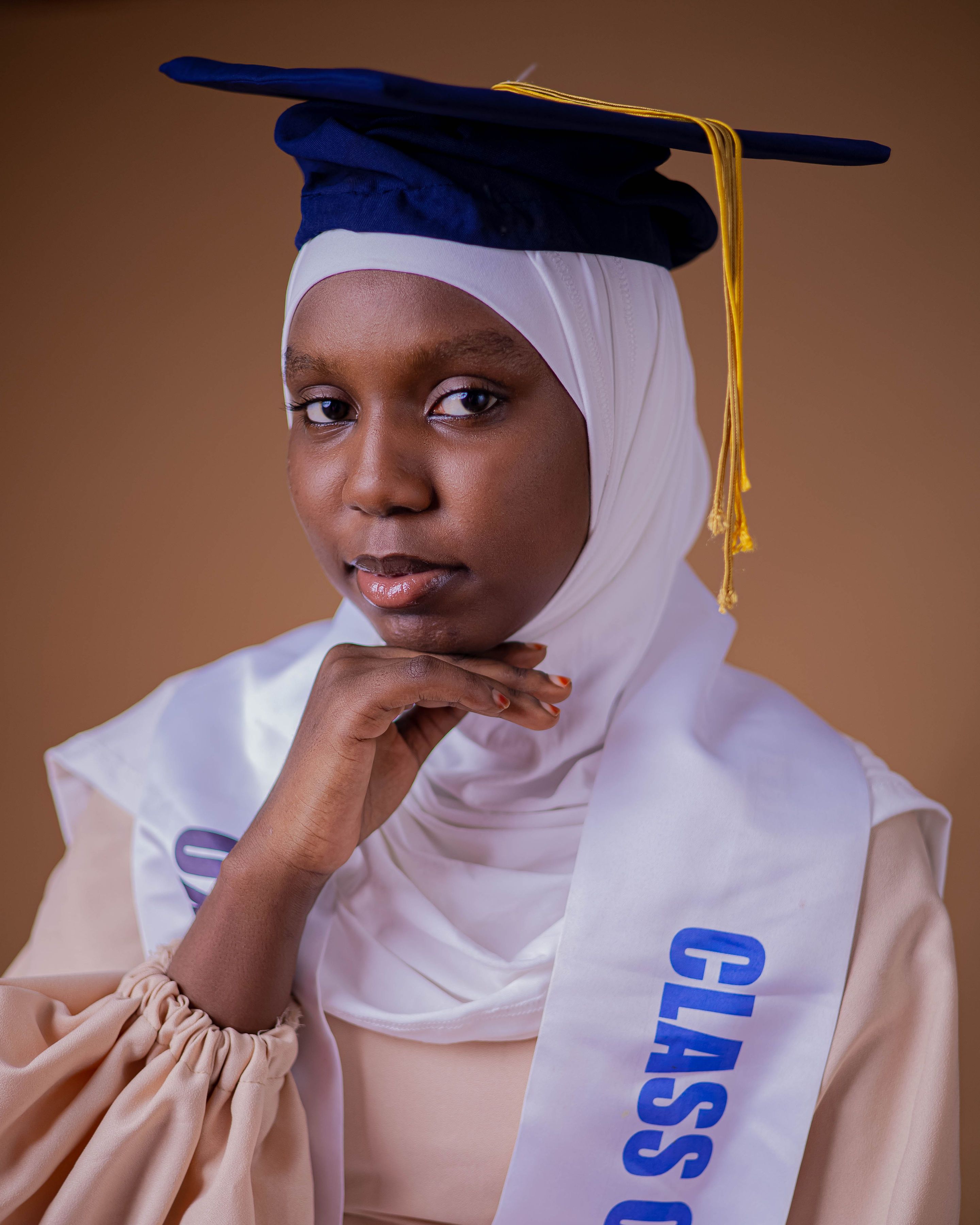 Young Graduate in Hijab with Cap and Gown  Free Stock Photo