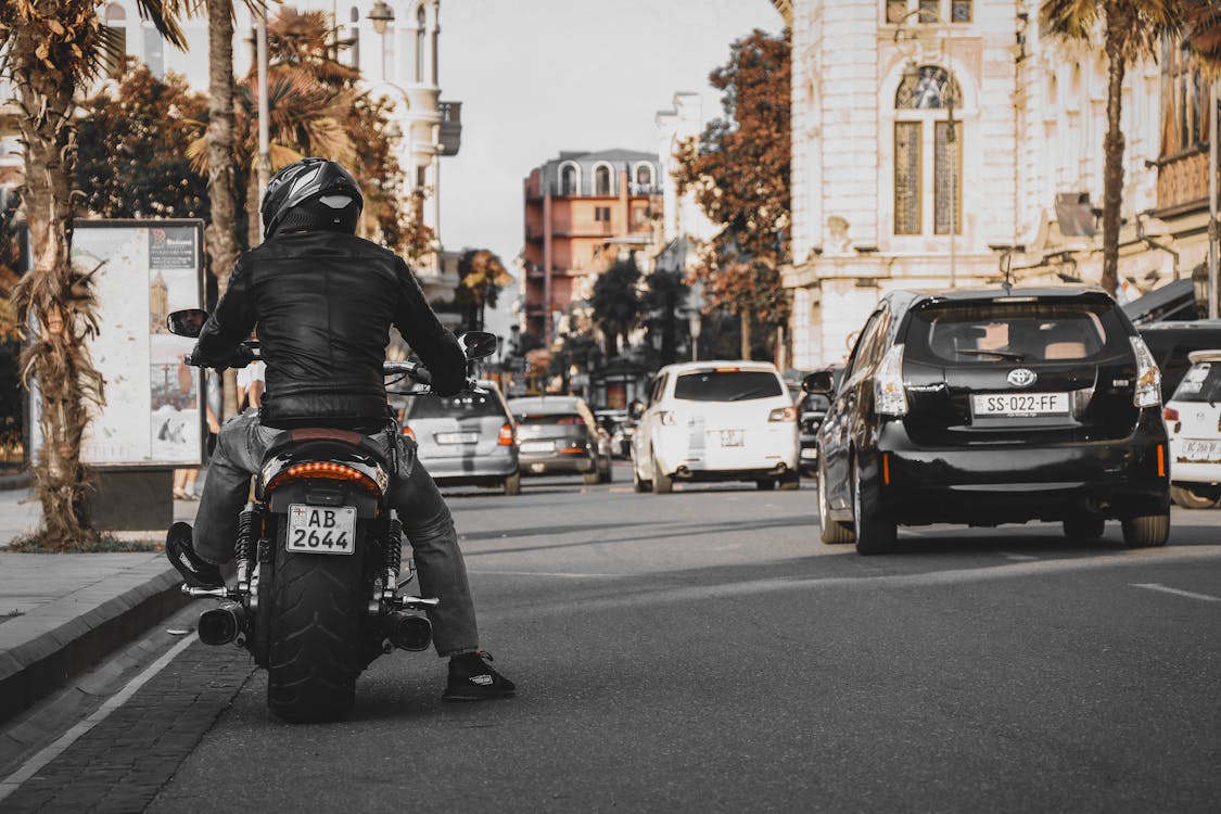 Free Man Wearing Jacket and Pants Riding On Motorcycle Stock Photo