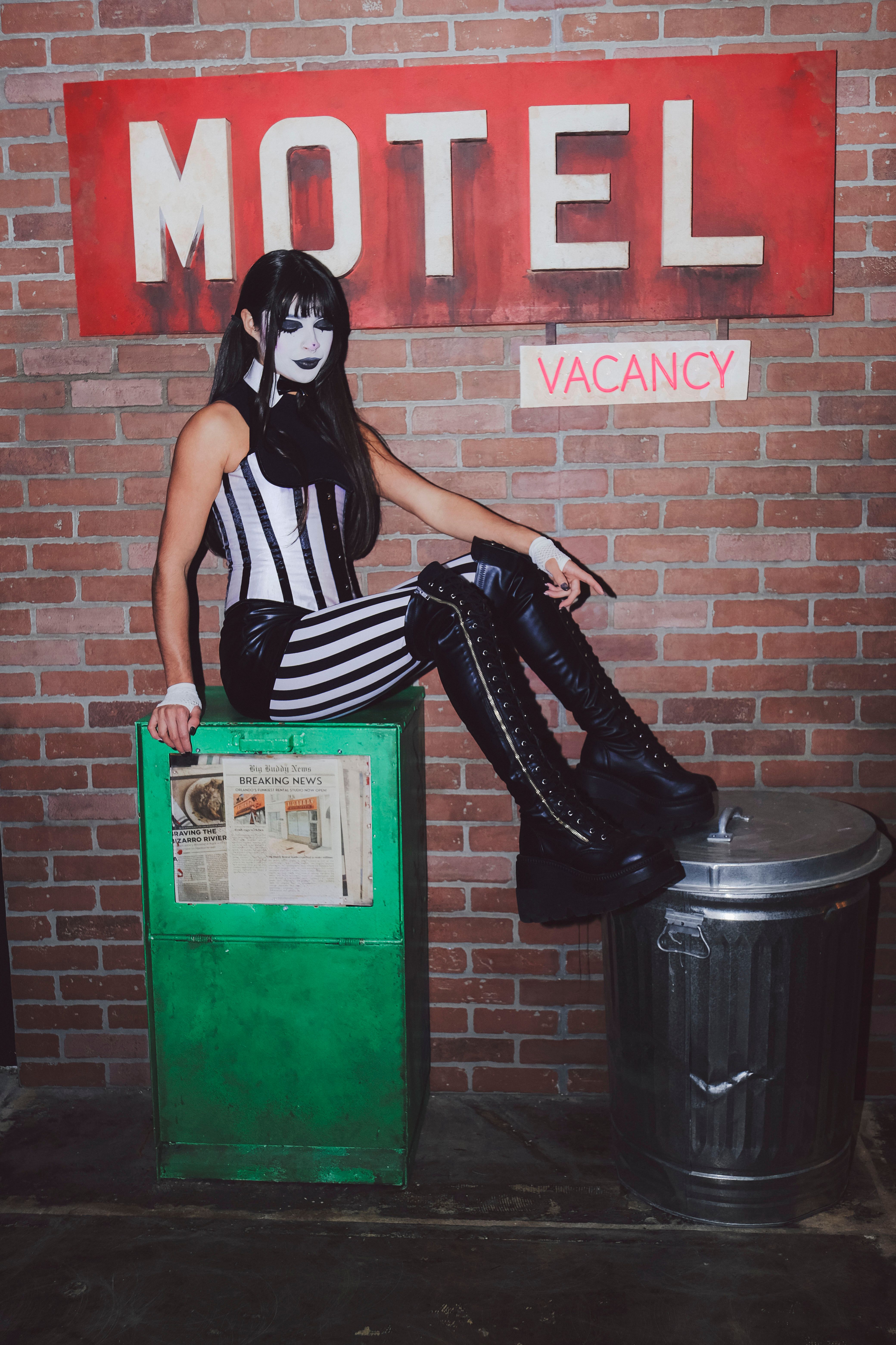 Alternative fashion shoot with motel backdrop · Free Stock Photo