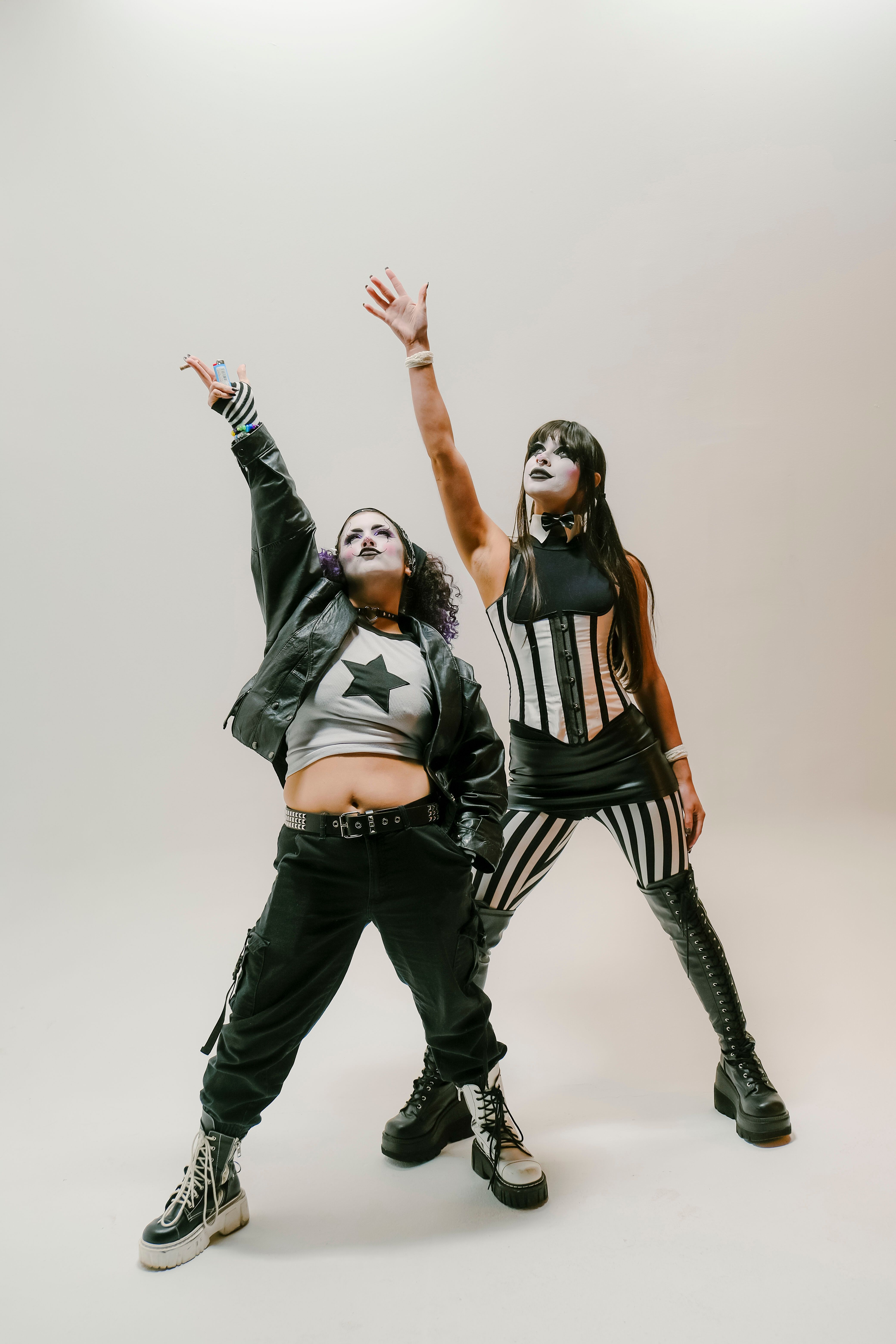 Dynamic Duo in Punk Rock Fashion Posing Indoors · Free Stock Photo