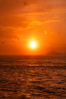 A stunning sunset with golden hues reflecting over the ocean waves, evoking a sense of calm and wonder.