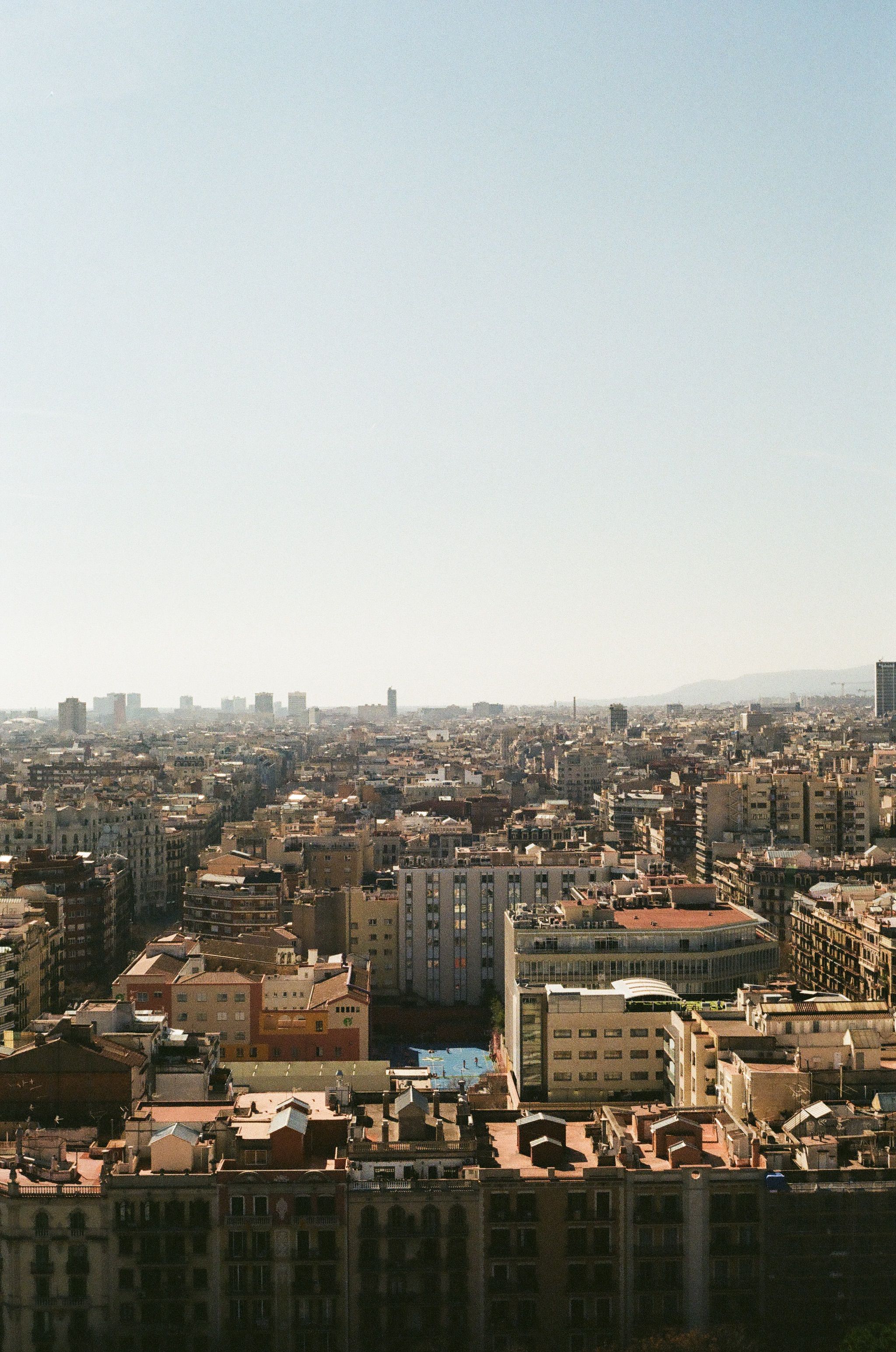 Discover the sprawling cityscape of Barcelona with this panoramic urban view, showcasing classic architecture.