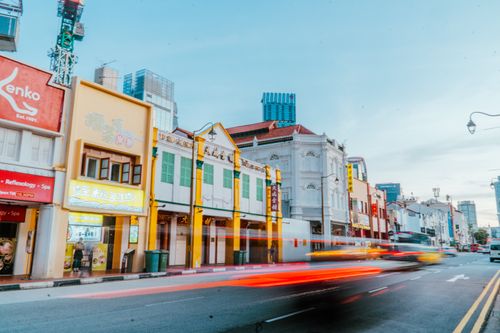 Free Colorful street in Singapore's Chinatown with motion blur from vehicles at daytime. Stock Photo