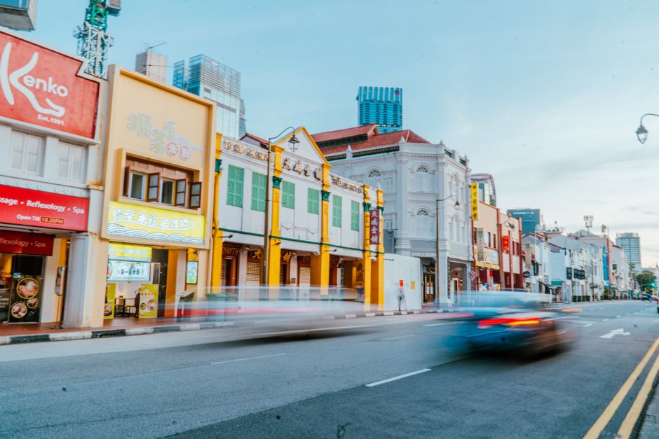 Photo by Christian Alemu on Pexels A dynamic street view in Singapore showcasing colorful historic shophouses and modern architecture. - Photo by Christian Alemu on Pexels