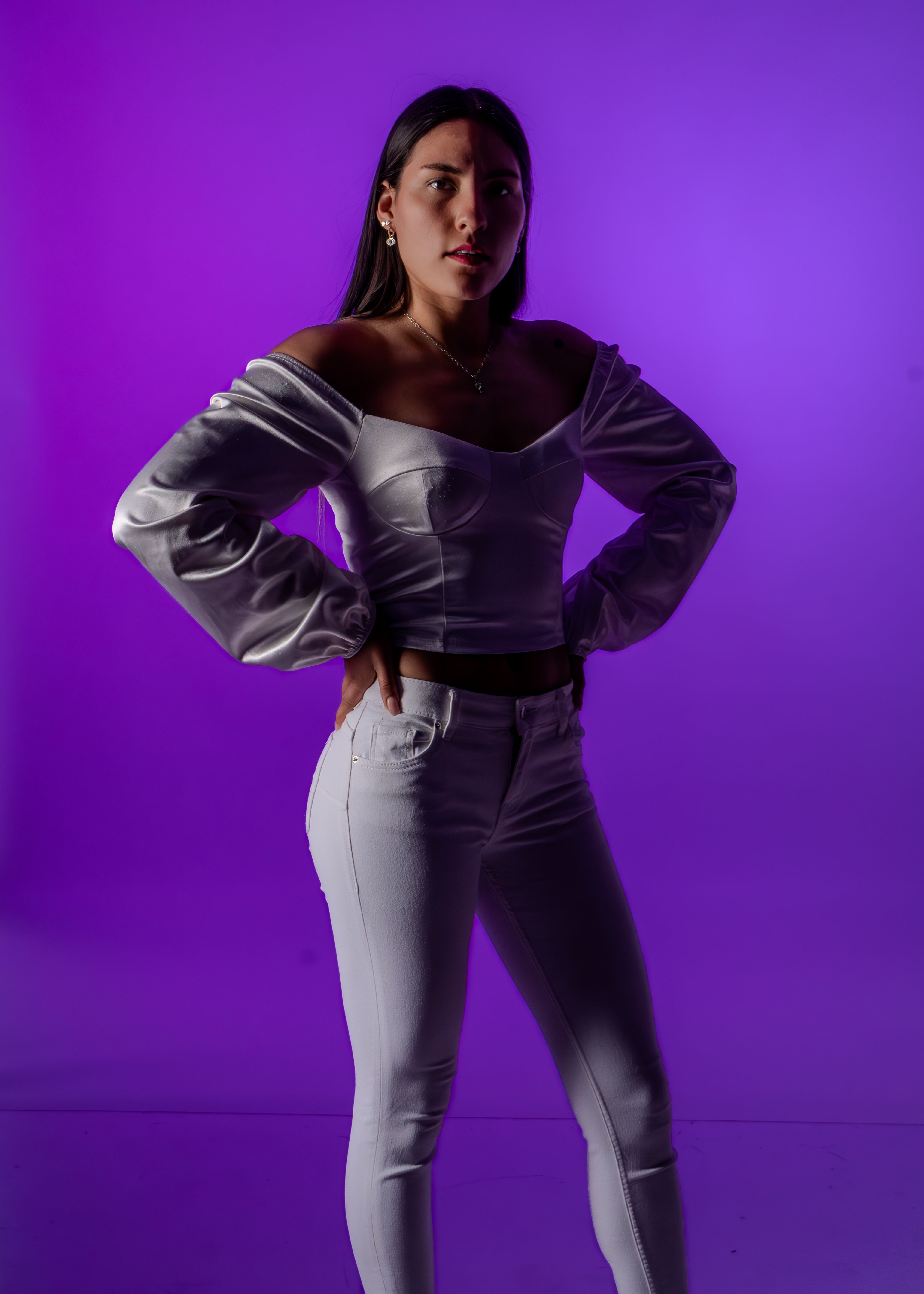 Stylish Portrait of a Woman with Purple Background · Free Stock Photo