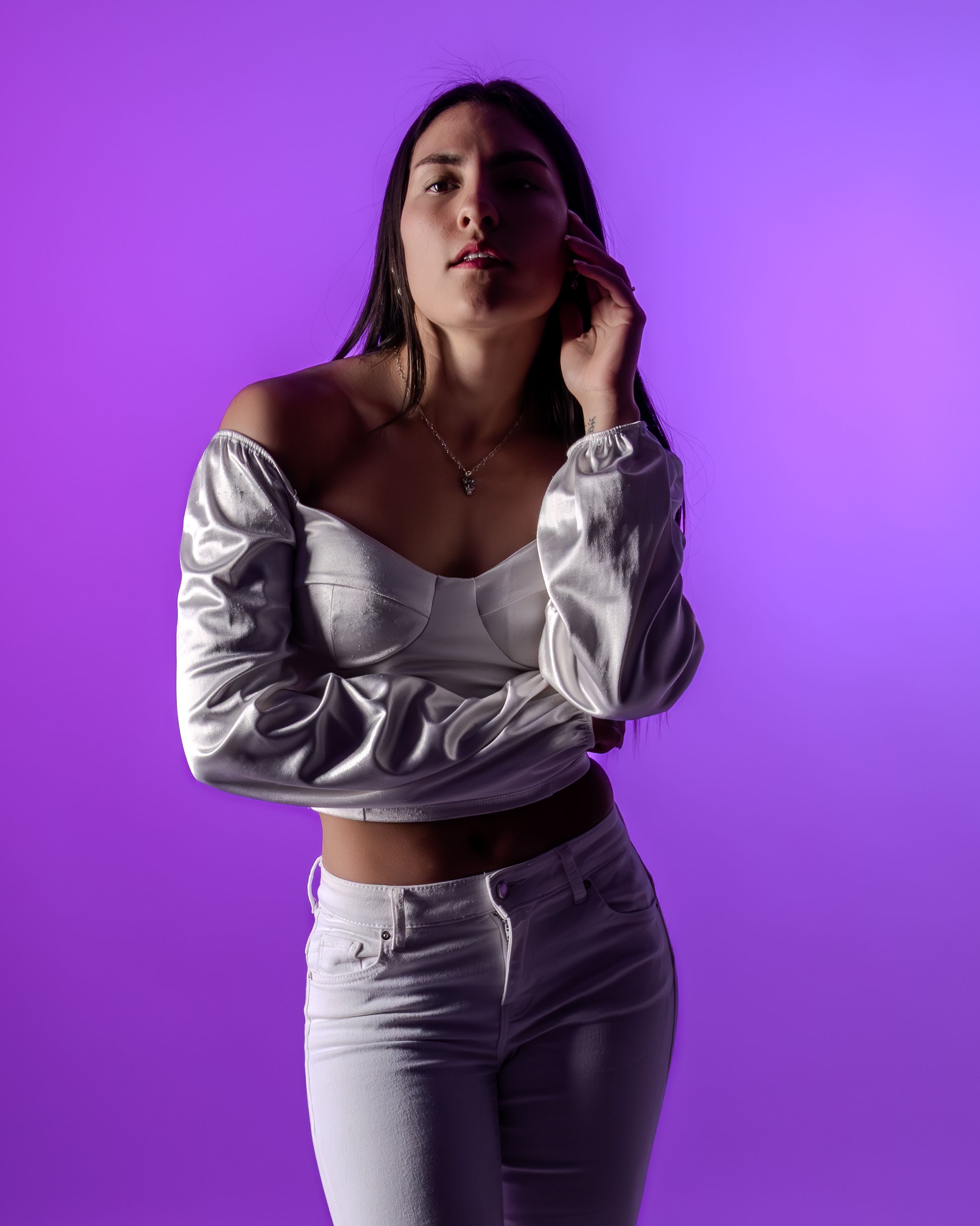Elegant Portrait of Woman Against Purple Background · Free Stock Photo