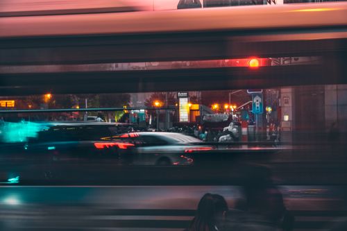 Free Long exposure capturing vibrant city lights and motion blur on a bustling night street. Stock Photo