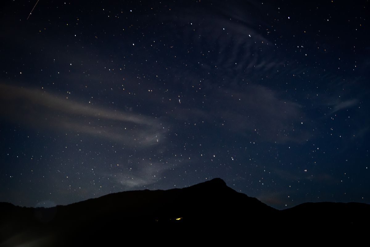 Night sky over a high ridge, photo by Thilina Alagiyawanna on Pexels