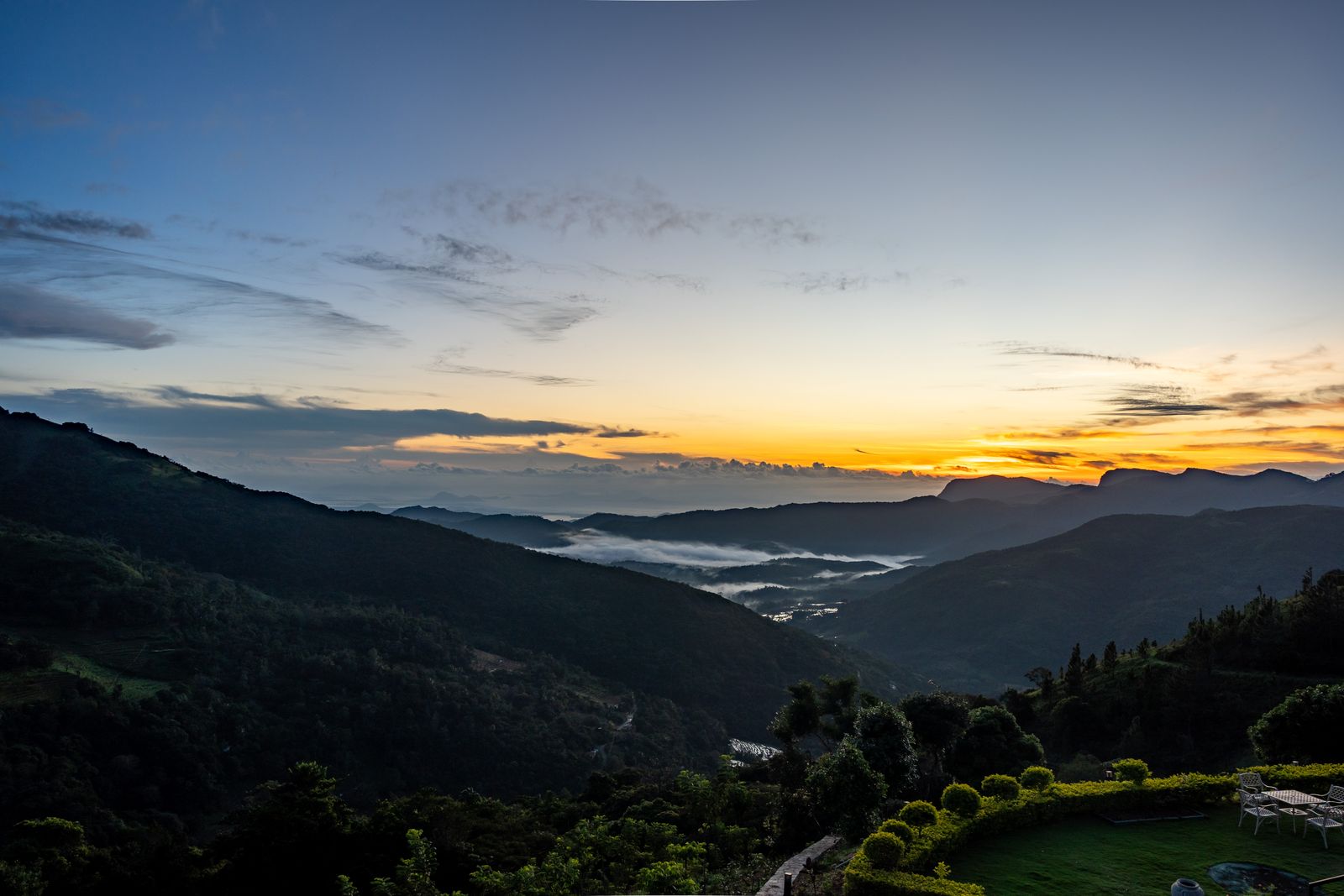 Colorful sunrise over Sri Lanka's misty mountains