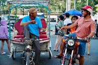 Street Scene with Motorbike and Rickshaw Interaction