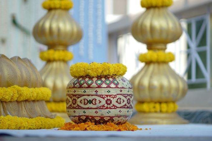 Haldi decor with marigolds and pots