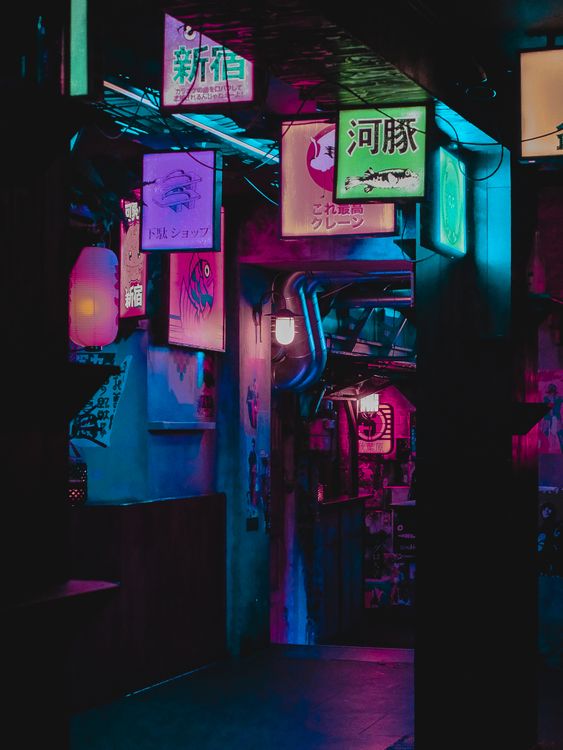 A narrow neon-lit alleyway in Shinjuku Golden Gai at night