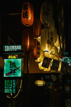 Discover the moody ambiance of Tokyo's streets with traditional lanterns and neon signs.