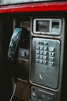 Close-up of a retro payphone featuring a keypad, capturing the essence of classic communication.