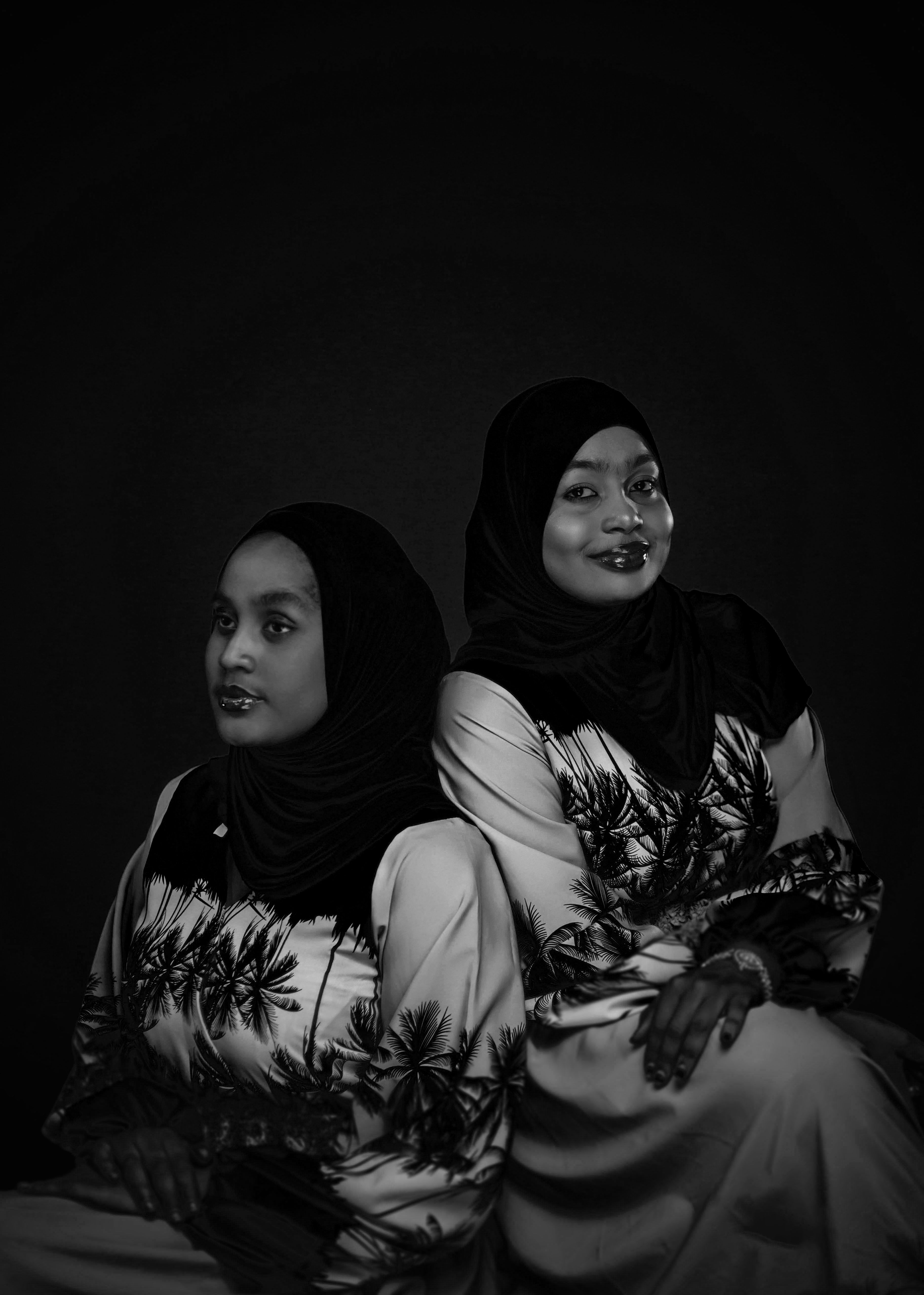 Elegant Portrait of Two Women in Traditional Attire · Free Stock Photo