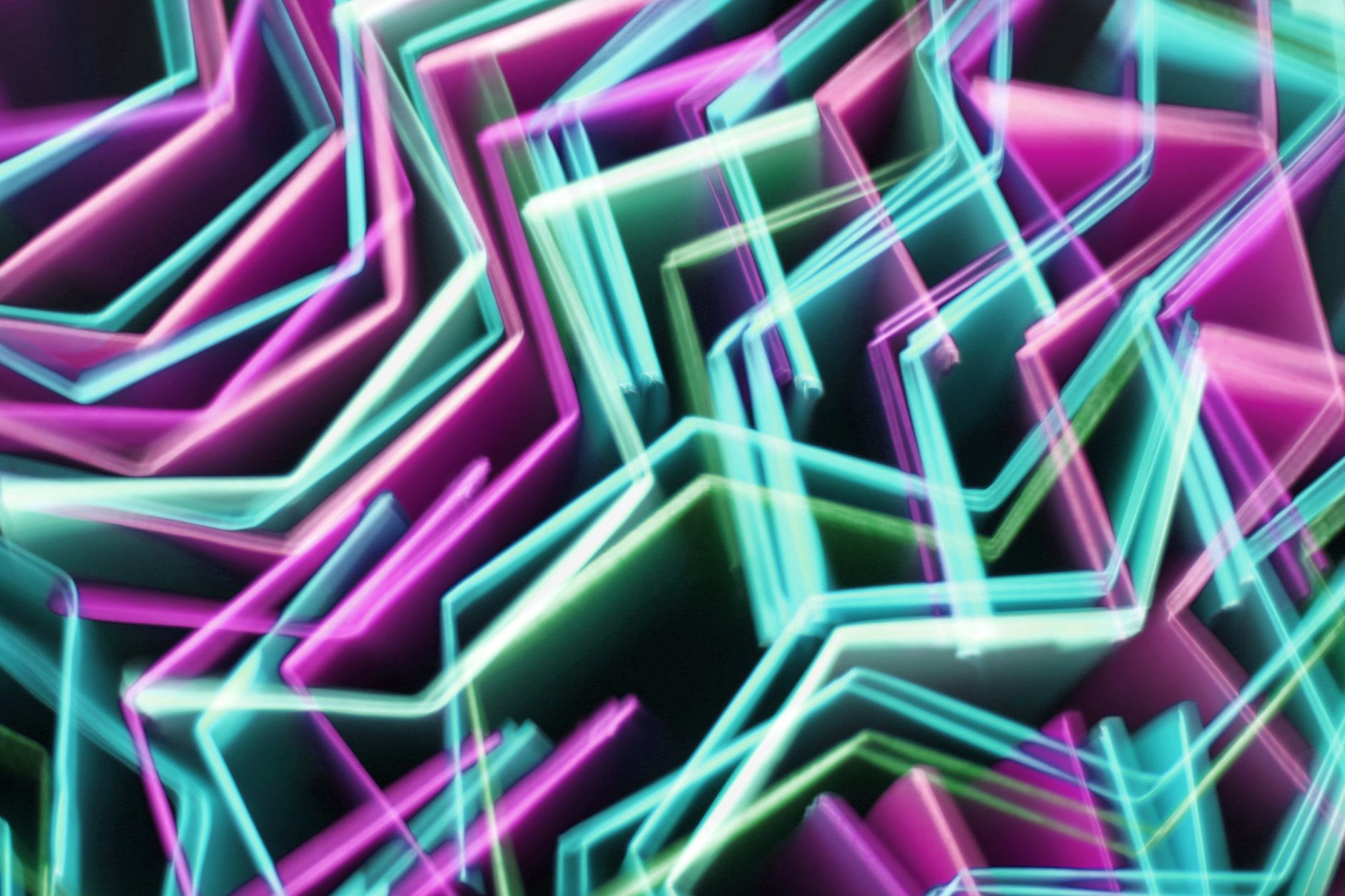 Dynamic abstract image featuring vibrant neon light patterns in pink, blue, and green hues.
