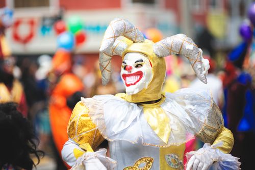 Free Vibrant carnival performer in a jester costume at a street event in Arequipa, Peru. Stock Photo