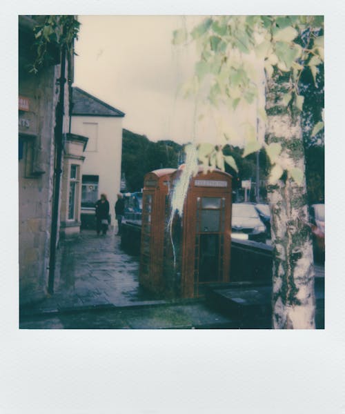 An Old Phone Booth Outside A Building