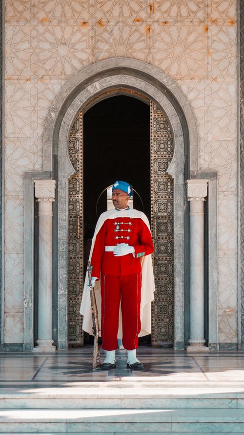 Free Traditional royal guard standing at the Mausoleum of Mohammed V in Rabat, Morocco. Stock Photo