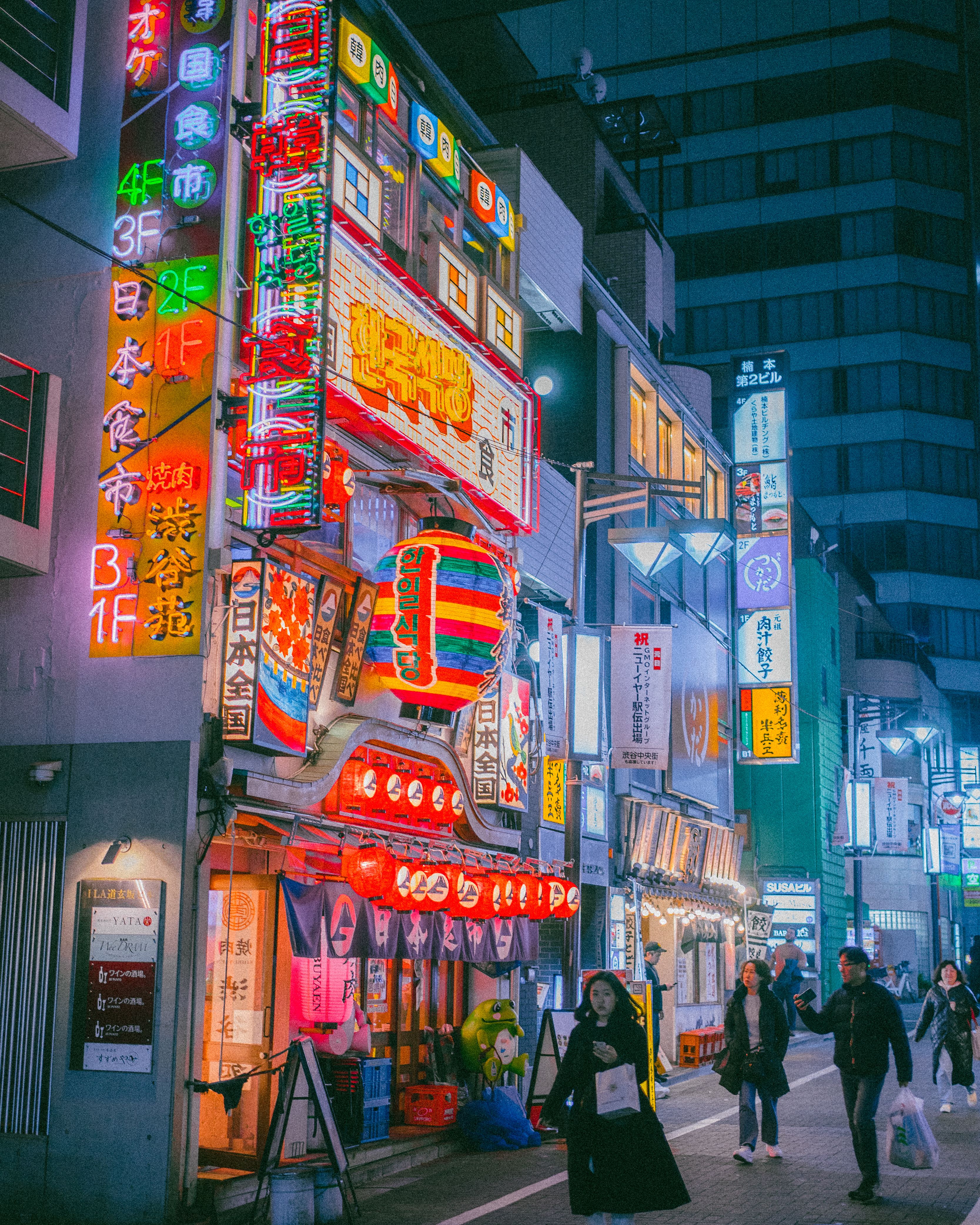 Vibrant Tokyo Street with Neon Signs at Night · Free Stock Photo