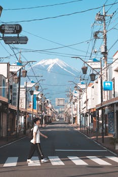 A peaceful street in Fujinomiya, Japan, showcasing Mount Fuji in the background.