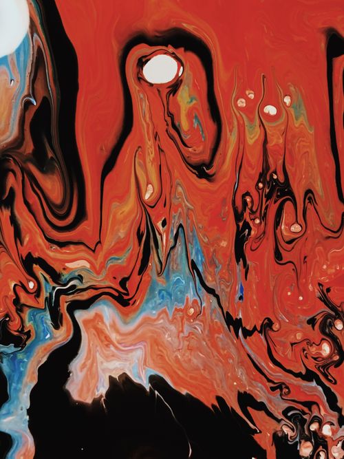 Free Dynamic abstract artwork featuring vivid red, blue, and black swirls creating a captivating visual flow. Stock Photo