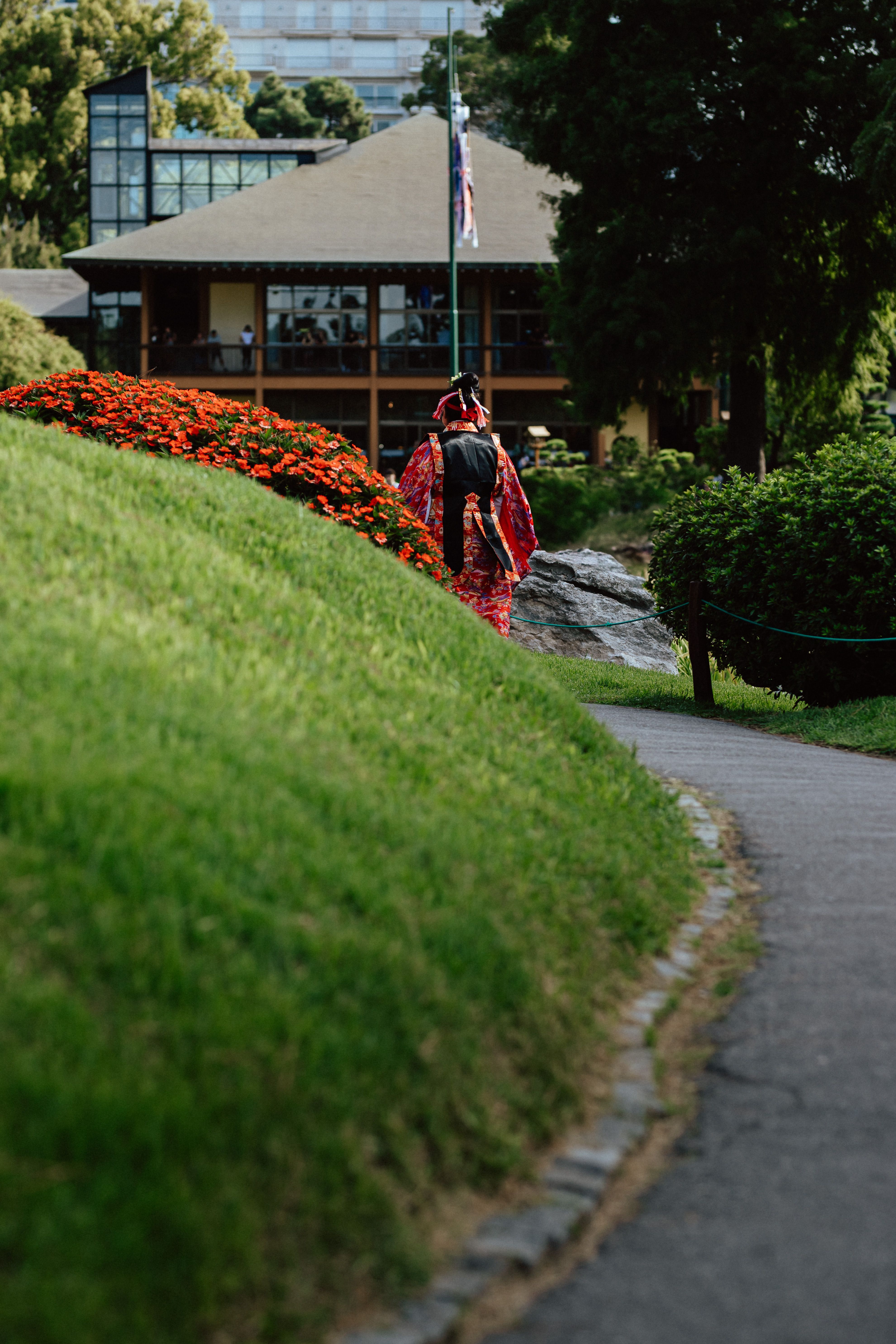 Japanese Garden Path with Traditional Attire · Free Stock Photo