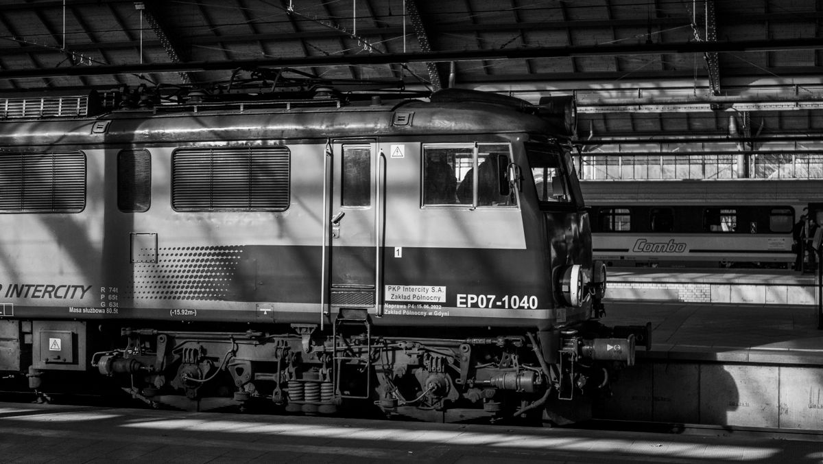 A classic intercity train stopped at a station platform