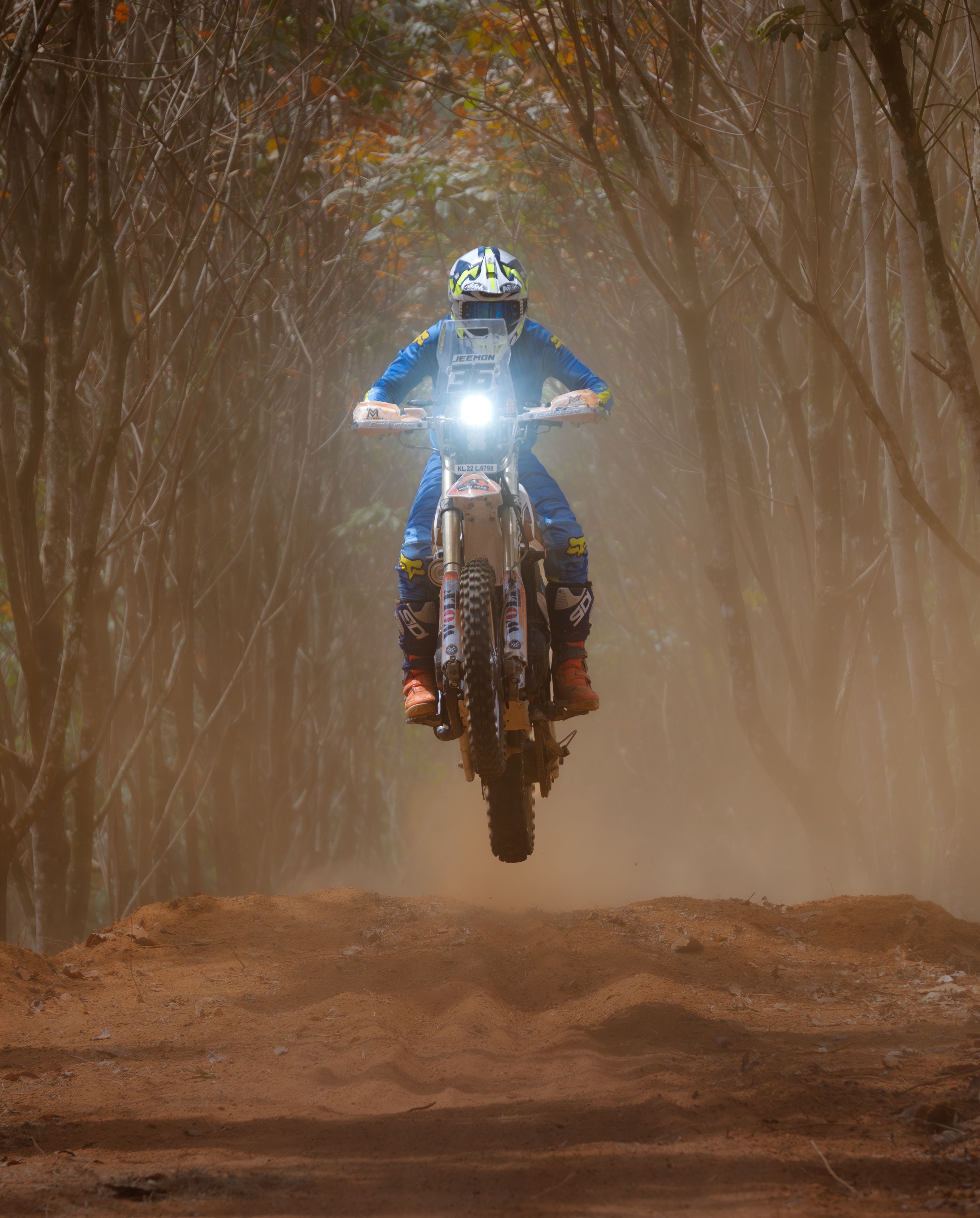 Dirt Bike Rider Jumping in Forest Trail · Free Stock Photo