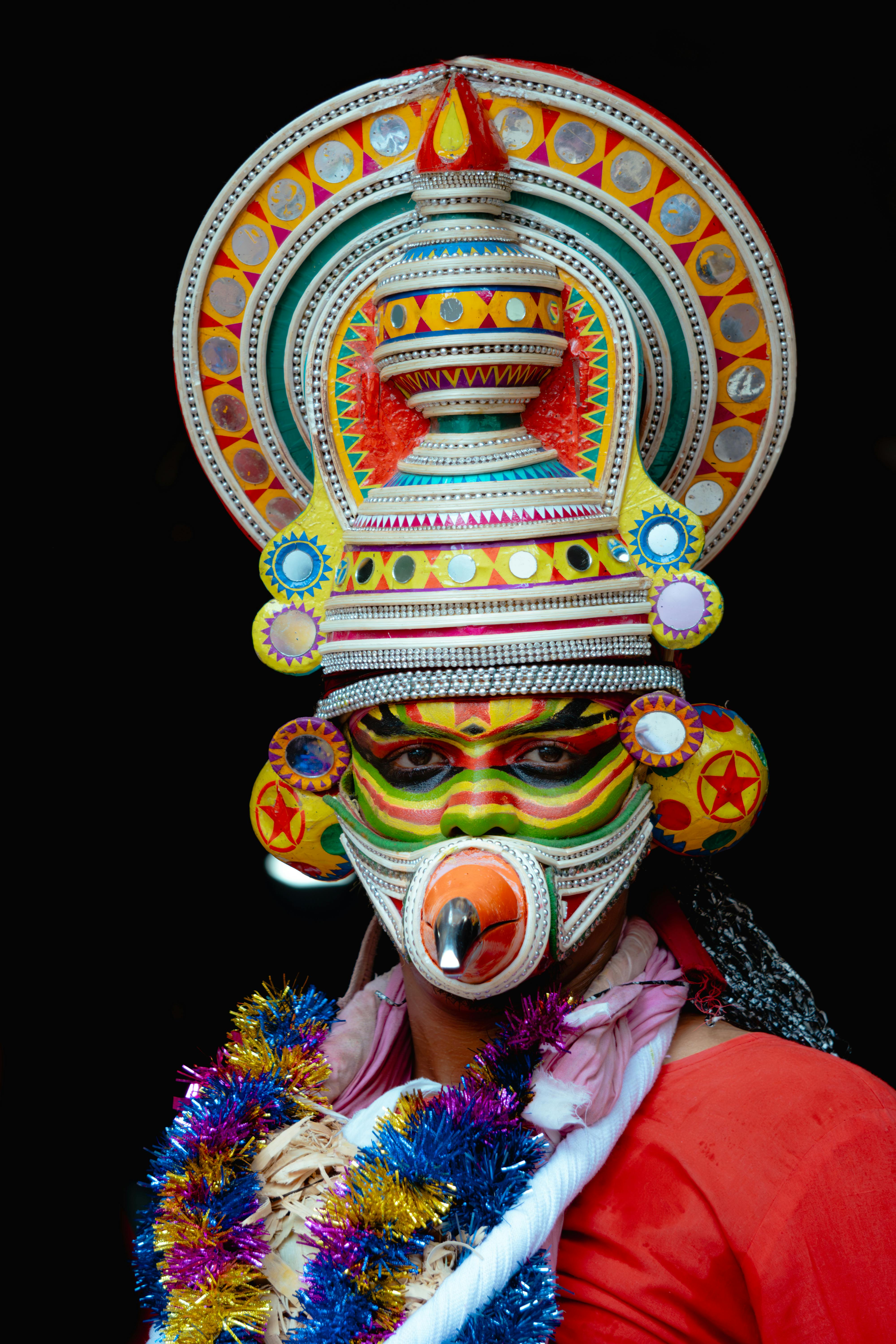 Free Colorful Kathakali dance attire showcasing elaborate makeup and headgear in vibrant detail. Stock Photo