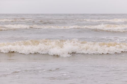Free Capture of gentle ocean waves creating a serene seascape on a tranquil day. Stock Photo