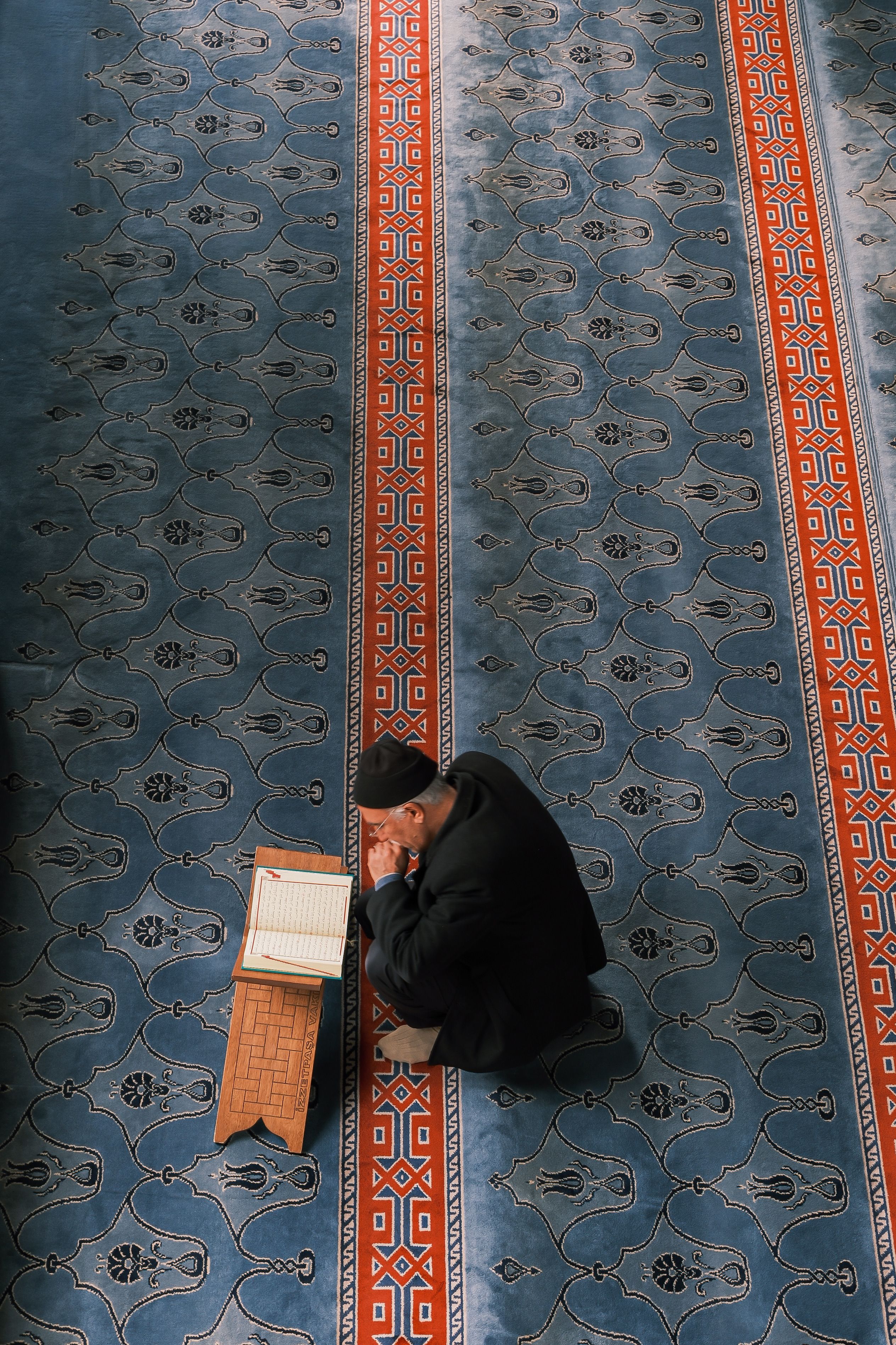 Ornate patterned carpet inside mosque