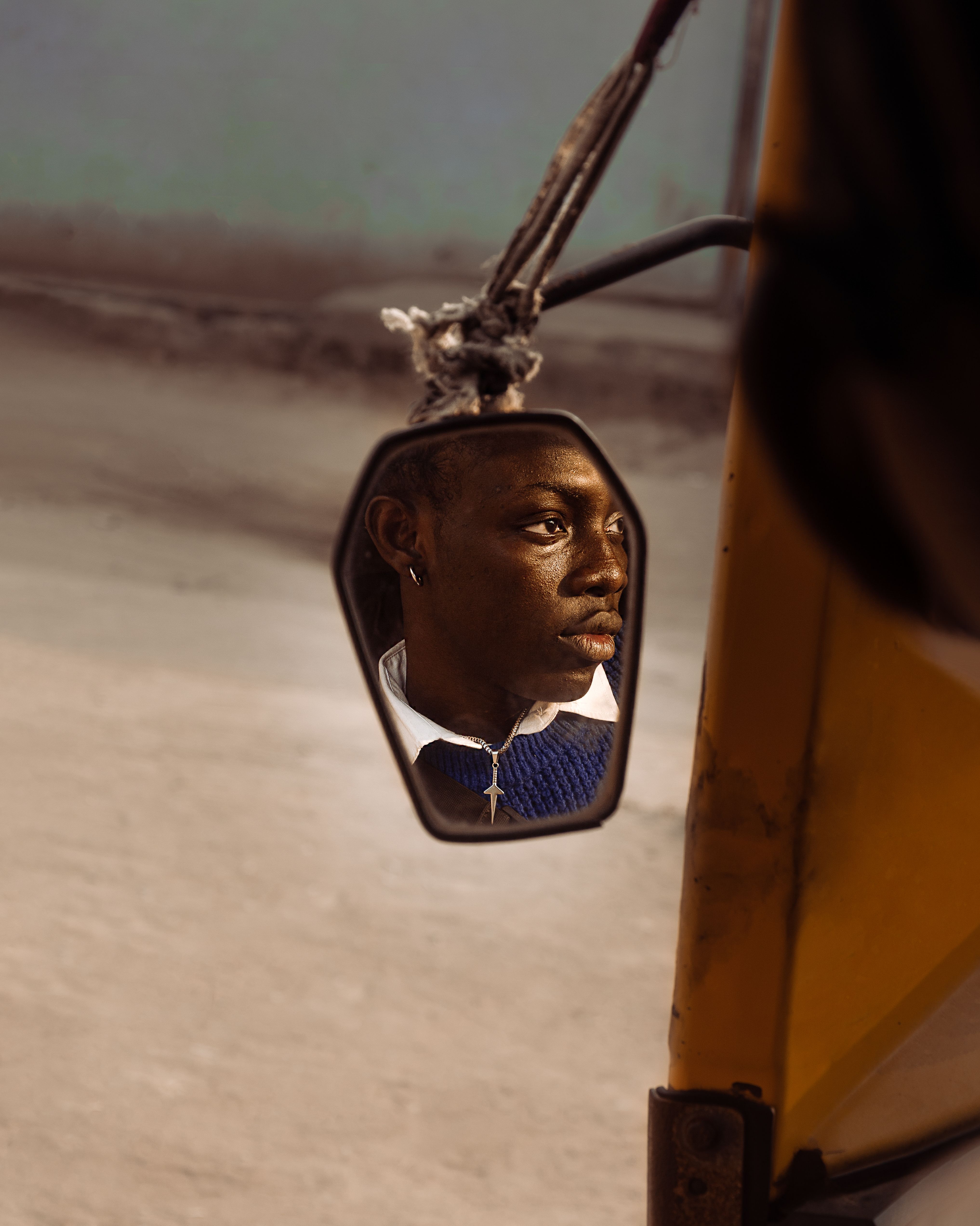 Reflective Portrait in Rearview Mirror · Free Stock Photo