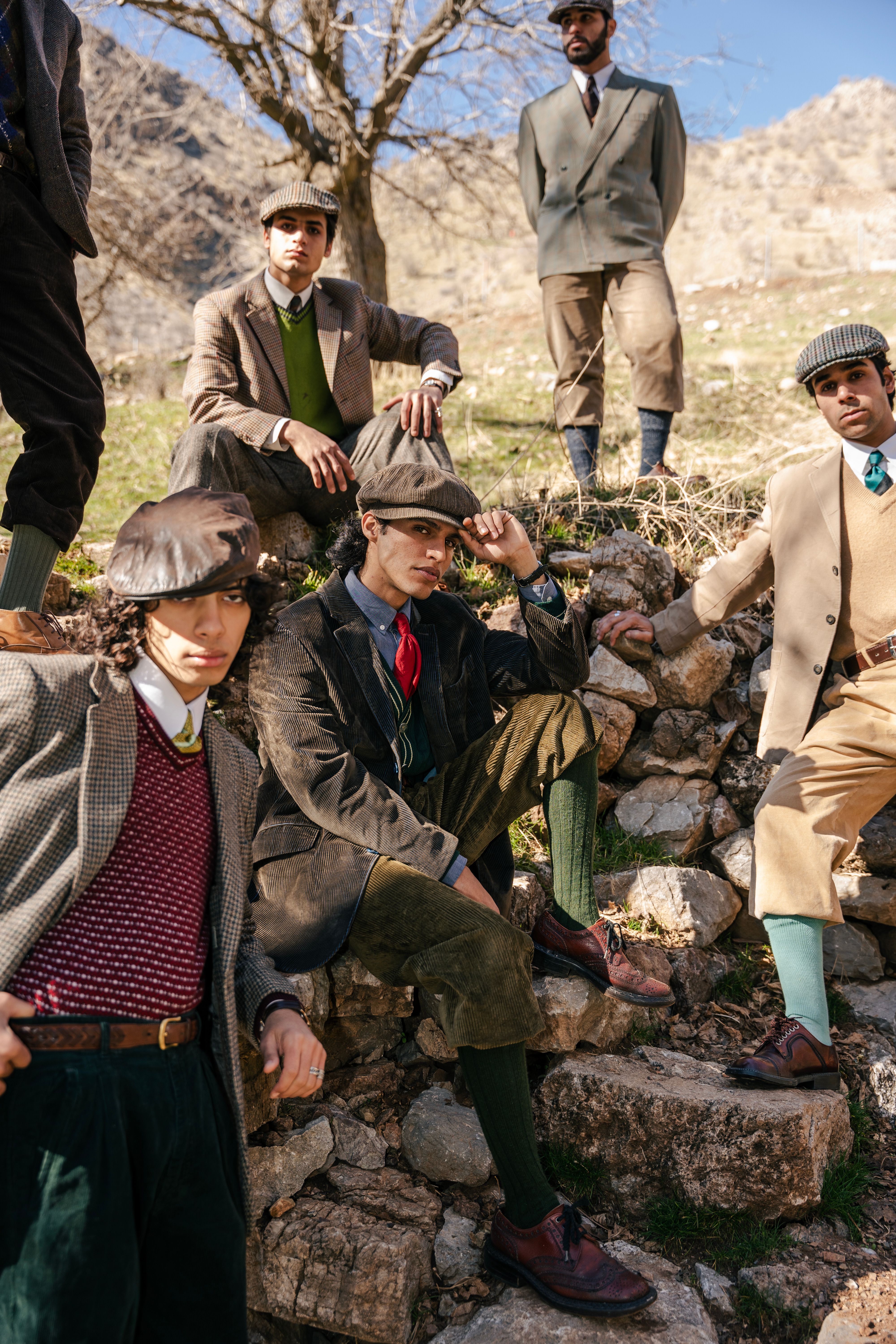 Group of Stylish Men in Vintage Outdoor Setting · Free Stock Photo