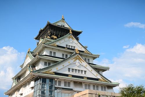Free Stunning view of Osaka Castle in Japan against a clear blue sky, highlighting its historical architecture. Stock Photo