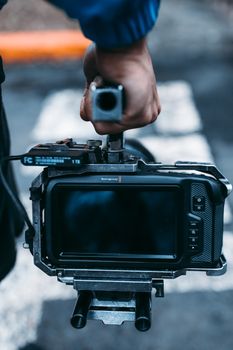 Close-up view of a professional camera rig handheld during a film production.